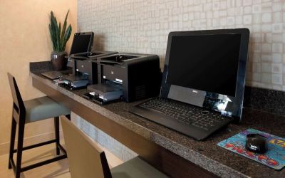 Business center with computers and printer at Sonesta ES Suites San Antonio Downtown Alamo Plaza.