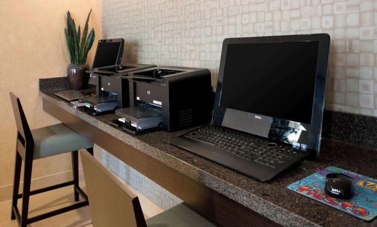 Business center with computers and printer at Sonesta ES Suites San Antonio Downtown Alamo Plaza.