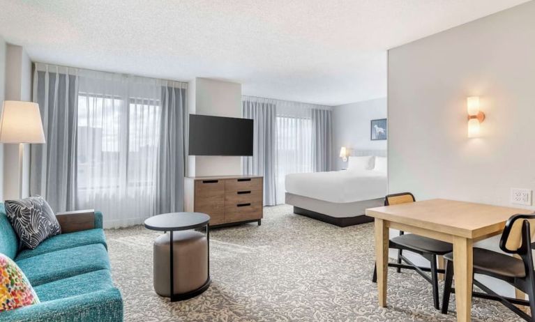 Day use room with workspace and lounge area at Sonesta ES Suites San Antonio Downtown Alamo Plaza.