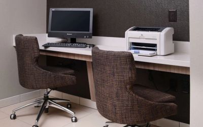 Business center with computer, printer and comfortable seating at Sonesta ES Suites Dallas Medical Market Center.