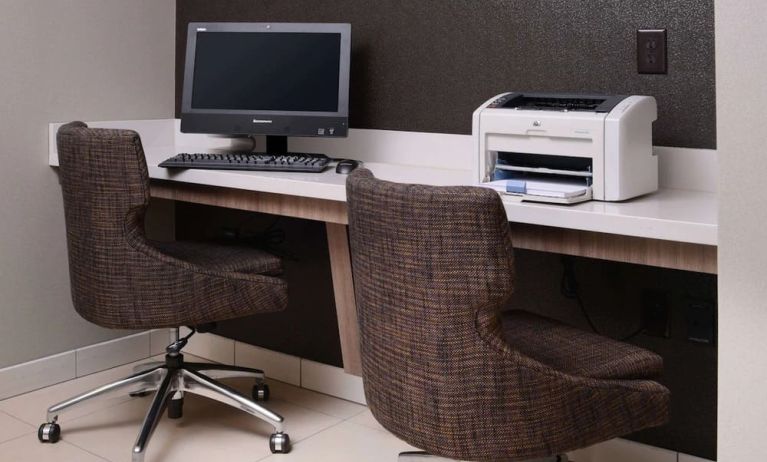 Business center with computer, printer and comfortable seating at Sonesta ES Suites Dallas Medical Market Center.