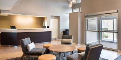 Hotel reception with lounge seating at Sonesta ES Suites Tempe.