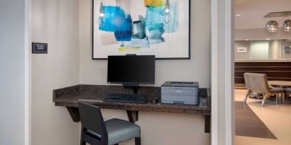 Business center with computer and printer at Sonesta ES Suites Atlanta Alpharetta North Point Mall.