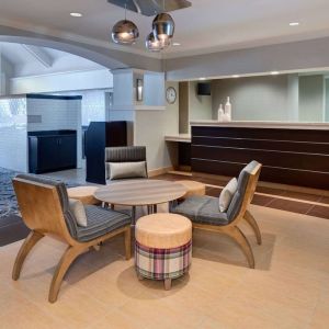 Reception and lounge area at Sonesta ES Suites Atlanta Alpharetta North Point Mall.