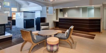 Reception and lounge area at Sonesta ES Suites Atlanta Alpharetta North Point Mall.