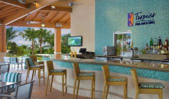 Beautiful and relaxing outdoor bar and restaurant by the pool at Hilton Orlando.