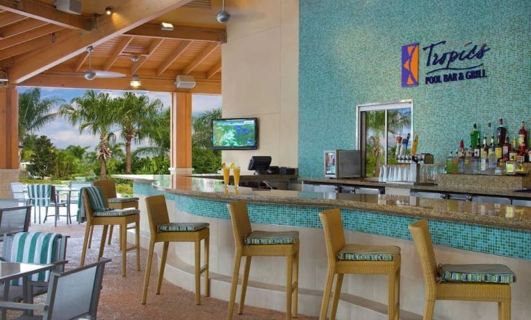 Beautiful and relaxing outdoor bar and restaurant by the pool at Hilton Orlando.