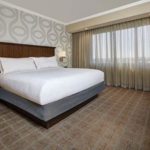 Comfortable king size bed at Embassy Suites By Hilton San Diego-La Jolla.