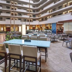 Breakfast area with natural light perfect for coworking at Embassy Suites By Hilton San Diego-La Jolla.