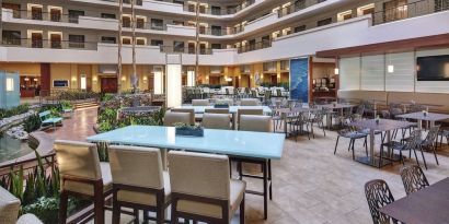 Breakfast area with natural light perfect for coworking at Embassy Suites By Hilton San Diego-La Jolla.