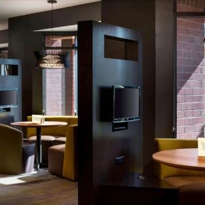 Dining area and coffee shop with comfortable seating perfect for coworking at Sonesta Select Tempe Downtown.