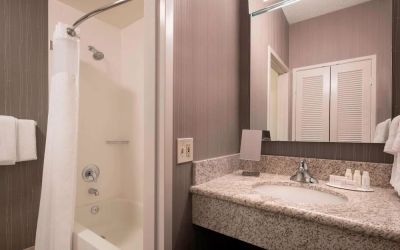 Private guest bathroom with shower and free toiletries at Sonesta Select Tempe Downtown.