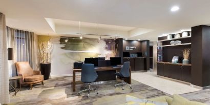 Business center with computers and printers at Sonesta Select Tempe Downtown.