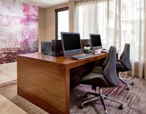 Business center with computers, printers and ergonomic chairs at Sonesta Select Raleigh Durham Airport Morrisville.