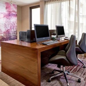 Business center with computers, printers and ergonomic chairs at Sonesta Select Raleigh Durham Airport Morrisville.