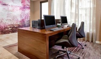 Business center with computers, printers and ergonomic chairs at Sonesta Select Raleigh Durham Airport Morrisville.