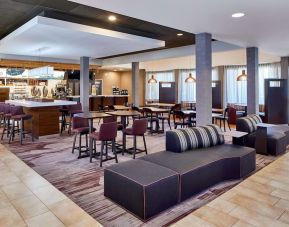 Dining area with comfortable seating perfect for coworking at Sonesta Select Raleigh Durham Airport Morrisville.