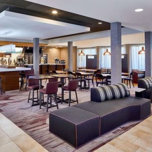 Dining area with comfortable seating perfect for coworking at Sonesta Select Raleigh Durham Airport Morrisville.