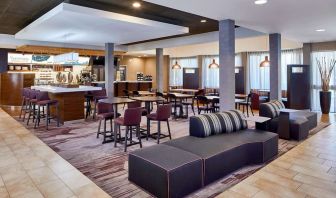 Dining area with comfortable seating perfect for coworking at Sonesta Select Raleigh Durham Airport Morrisville.