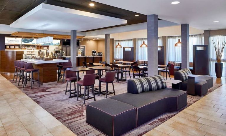 Dining area with comfortable seating perfect for coworking at Sonesta Select Raleigh Durham Airport Morrisville.