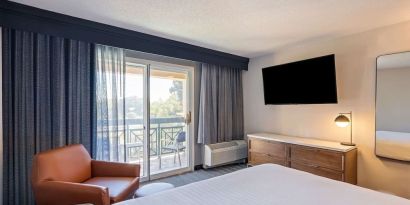 Bright and spacious day use room with balcony and work desk at Sonesta Select Pleasant Hill.