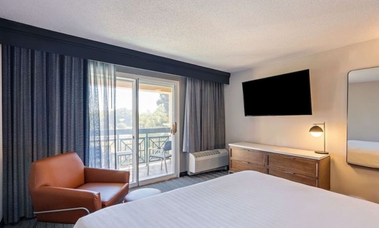 Bright and spacious day use room with balcony and work desk at Sonesta Select Pleasant Hill.