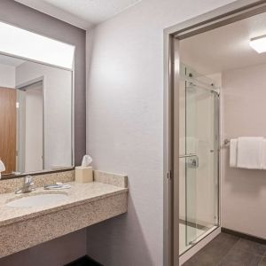 Private guest bathroom with shower and free toiletries at Sonesta Select Pleasant Hill.