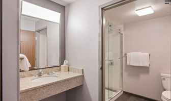 Private guest bathroom with shower and free toiletries at Sonesta Select Pleasant Hill.