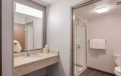 Private guest bathroom with shower and free toiletries at Sonesta Select Pleasant Hill.