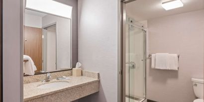 Private guest bathroom with shower and free toiletries at Sonesta Select Pleasant Hill.