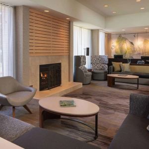 Lobby lounge with comfortable seating and fireplace at Sonesta Select Pleasant Hill.