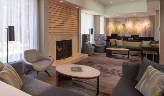 Lobby lounge with comfortable seating and fireplace at Sonesta Select Pleasant Hill.