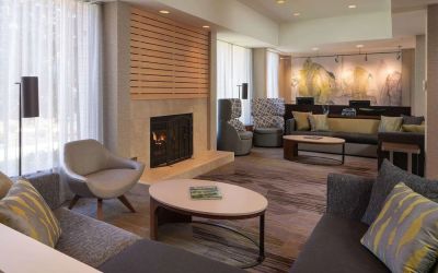 Lobby lounge with comfortable seating and fireplace at Sonesta Select Pleasant Hill.