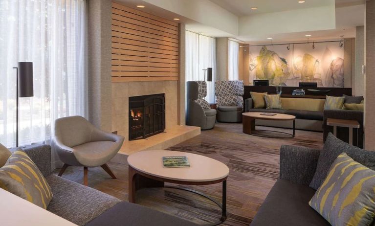 Lobby lounge with comfortable seating and fireplace at Sonesta Select Pleasant Hill.