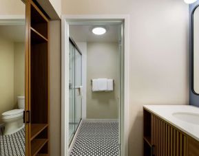 Private guest bathroom with shower at Sonesta Select Philadelphia Airport.