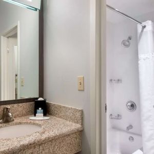 Private guest bathroom with shower and free toiletries at Sonesta Select Newport Middletown.