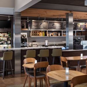 On-site coffee shop with seating area, perfect for coworking at Sonesta Select Newport Middletown.