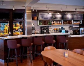 Hotel bar with lounge area at Sonesta Select Kansas City Airport Tiffany Springs.