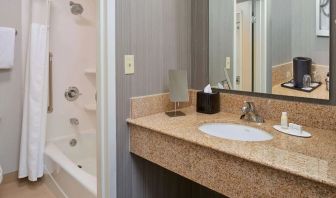 Private guest bathroom with shower and free toiletries at Sonesta Select Indianapolis Carmel.