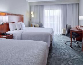 Bright and spacious day use twin room with work desk and floor to ceiling window at Sonesta Select Indianapolis Carmel.