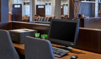 Business center with computer, printer and ergonomic chairs at Sonesta Select Indianapolis Carmel.