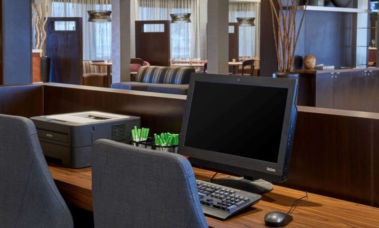 Business center with computer, printer and ergonomic chairs at Sonesta Select Indianapolis Carmel.