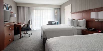 Bright and spacious day use twin room with work desk and floor to ceiling window at Sonesta Select Los Angeles LAX El Segundo.