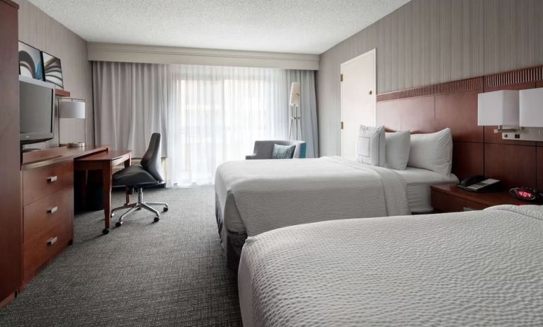 Bright and spacious day use twin room with work desk and floor to ceiling window at Sonesta Select Los Angeles LAX El Segundo.