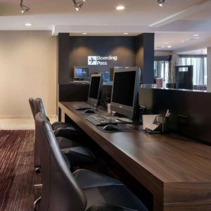 Business center with computers, printer and ergonomic chairs at Sonesta Select Los Angeles LAX El Segundo.