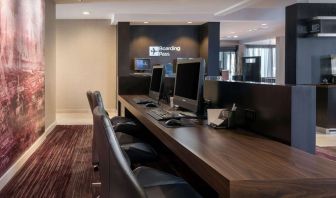 Business center with computers, printer and ergonomic chairs at Sonesta Select Los Angeles LAX El Segundo.