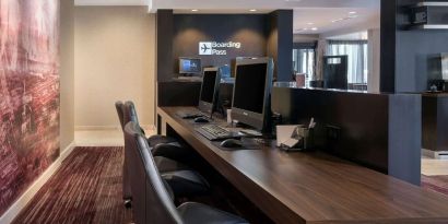 Business center with computers, printer and ergonomic chairs at Sonesta Select Los Angeles LAX El Segundo.