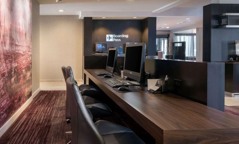 Business center with computers, printer and ergonomic chairs at Sonesta Select Los Angeles LAX El Segundo.