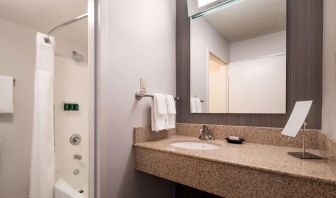 Private guest bathroom with shower and free toiletries at Sonesta Select Los Angeles LAX El Segundo.