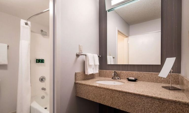 Private guest bathroom with shower and free toiletries at Sonesta Select Los Angeles LAX El Segundo.